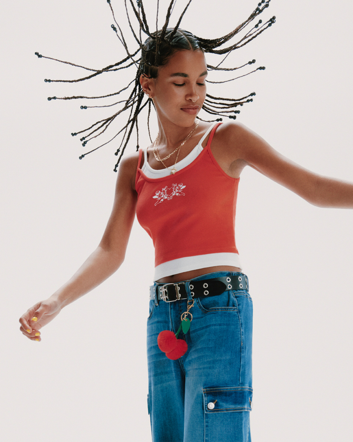 No Boundaries studio campaign featuring a red tank and blue cargo denim